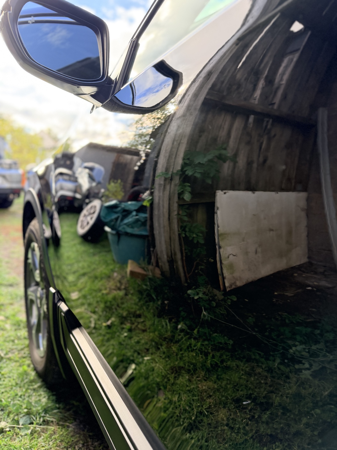 Deeply reflective black vehicle paint along the side doors